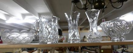 2 cut glass vases, a cut glass jug and 2 cut glass trifle dishes,.