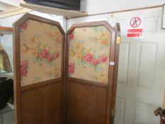 An Edwardian 3 fold room screen with floral fabric panels.