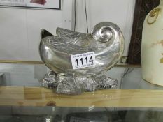 A silver plated nautilus shell spoon warmer.
