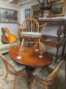 A set of 4 Ercol dining chairs and an Ercol carver chair.