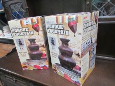 2 boxed chocolate fountains.