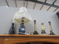 A quantity of table lamps.