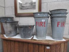 A quantity of fire buckets.