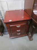A 3 drawer mahogany chest.
