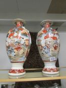 A pair of Imari vases.