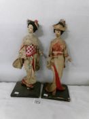 A pair of Japanese Geisha figures.