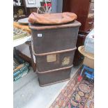 A cabin trunk and a leather bag.