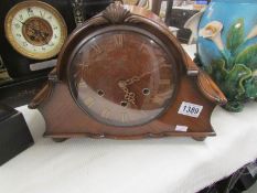 A mahogany mantel clock,