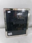 A silver photograph frame hall marked Carr's of Sheffield 1996. Approximately 23.5 x 28.5 cm (9.