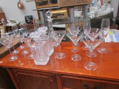 3 glass decanters, 6 champagne flutes and 10 cocktail glasses.