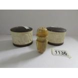 An early 20th century salt and pepper and an earlier ivory pepperette.