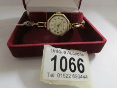 A Rotary ladies wrist watch in 9ct gold on a gold openwork bracelet, (15 grams).