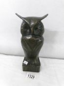 A heavy bronze owl with impressed initial m.B., Approximately 25cm tall.