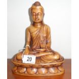 A resin figure of a Buddha.