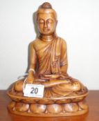 A resin figure of a Buddha.