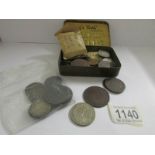 A quanitty of old UK and foreign coins and tokens including Clayton & Shuttleworth,