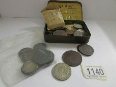 A quanitty of old UK and foreign coins and tokens including Clayton & Shuttleworth,