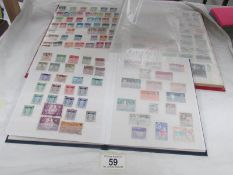 2 albums of assorted stamps.