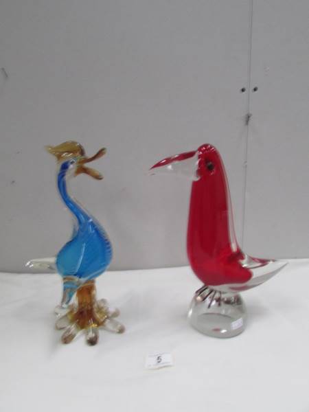 A heavy red Murano glass bird and a heavy blue Murano glass duck.