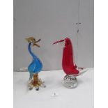 A heavy red Murano glass bird and a heavy blue Murano glass duck.