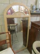 A modern arched top mirror.