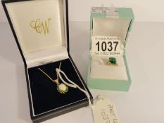 A gold ring marked 9ct with green stone and a 9ct gold pendant on chain.