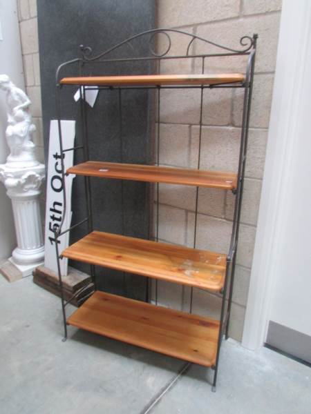 A set of wrought iron and pine shelves.