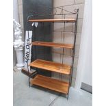 A set of wrought iron and pine shelves.