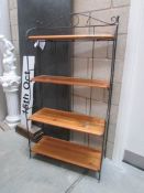 A set of wrought iron and pine shelves.