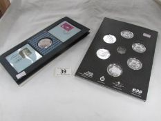 A mint coin presentation pack 'Day of the Concorde' and a mint R.A.F coin set (one coin missing).