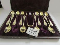 A cased set of silver tea spoons with sugar tongs, H.M Sheffield, Martin Hall & Co.