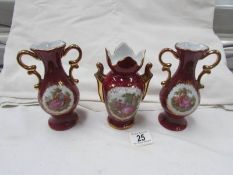 A pair of Limoges vases and one other.