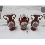 A pair of Limoges vases and one other.