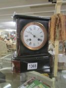 A 19th century black marble mantel clock.