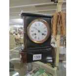 A 19th century black marble mantel clock.