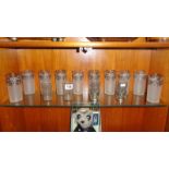 10 glass tumblers with white metal decoration and 2 pairs of smaller tumblers also with white metal