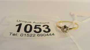 An 18ct gold diamond cluster ring (missing one stone), size O.