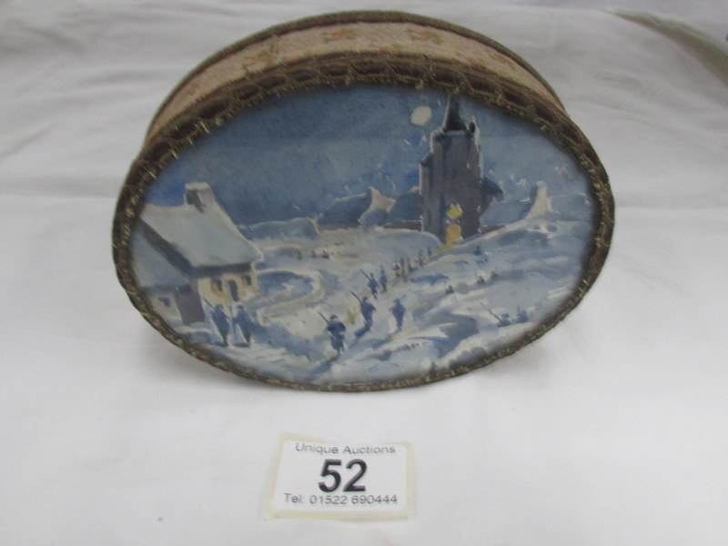 A chocolate box with embroidered sides and signed winter scene in lid.