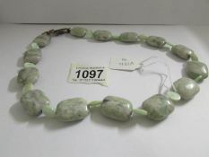 A green bead necklace.