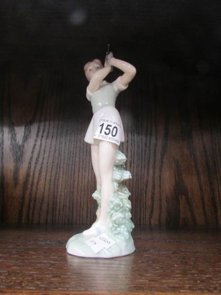 A NAO girl golfing figure.