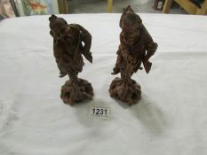 A pair of 1930's carved wood Chinese figures.