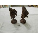 A pair of 1930's carved wood Chinese figures.