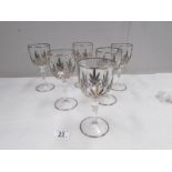 A set of 6 wine goblets decorated with white metal.