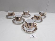 A set of 6 fine gilded porcelain coffee cups and saucers. Stamped 'H.