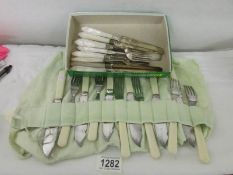 A quantity of fish knives and forks.