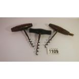 3 vintage corkscrews, one with brush end.