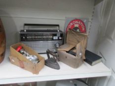 A mixed lot including radio, gas mask, mincer, flat iron etc.