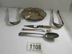 A silver ashtray, 2 silver sugar tongs, a spoon, small eel fork and Mason's trowel page turner,