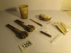 2 carved bone spoons, a horn beaker, a mother of pearl purse,