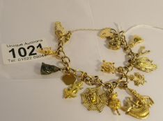 A 9ct gold charm bracelet with charms including some marked 9ct, total weight 37 grams.